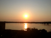 Sun setting over the Mississippi River looking at Arkansas
